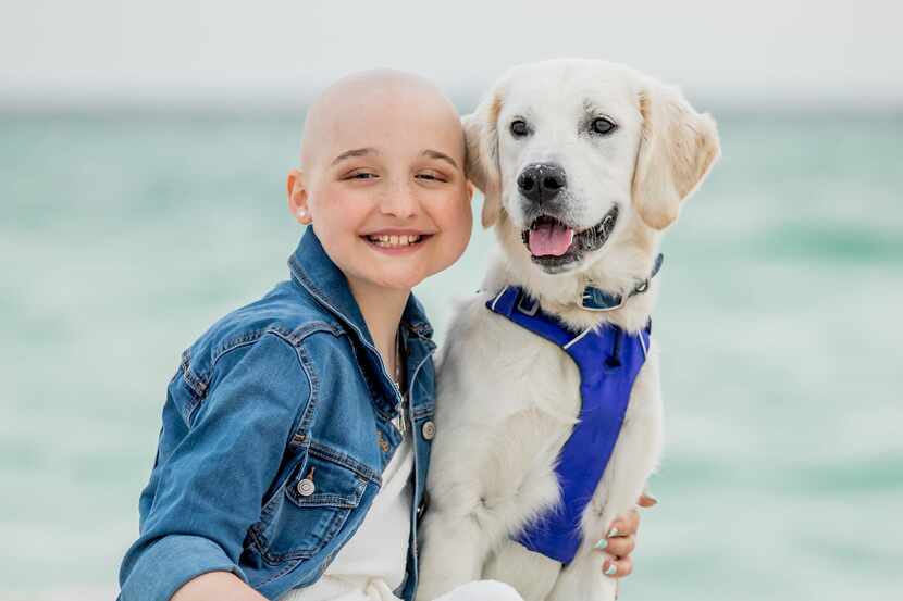 Isabelle “Izzy” Martin and her dog, Blu, enjoyed a family beach trip to Watercolor, Fla., in...