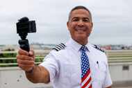 Southwest Airlines pilot Ernie Meeks poses with the camera he uses to record his content at...