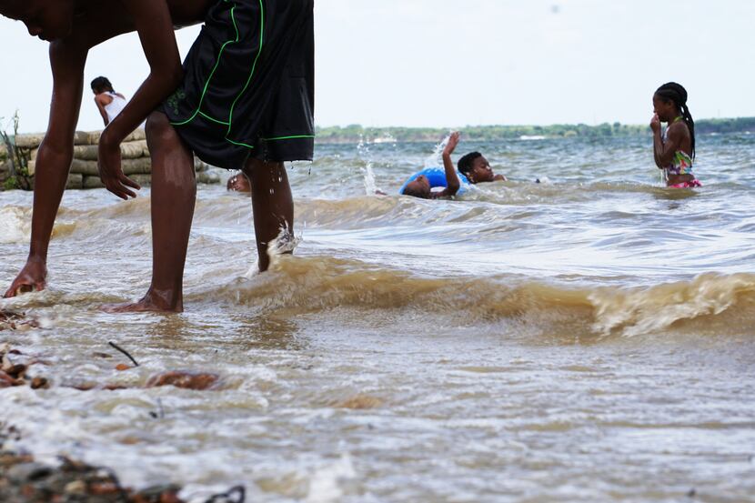 Children enjoyed the water at Cedar Hill State Park on June 25. Although black residents...