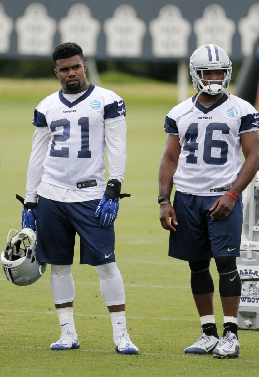 Dallas Cowboys running backs Ezekiel Elliott (21) and Alfred Morris (46) watch the as the...