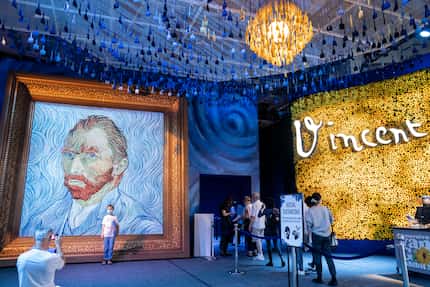 At the New York show, guests arrive beside a giant replica of celebrated painter Vincent Van...