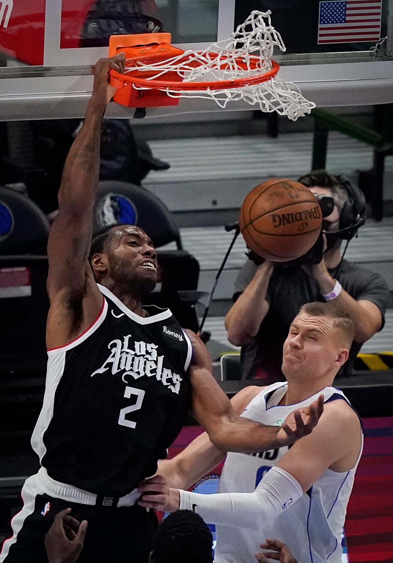 LA Clippers forward Kawhi Leonard (2) dunks the ball over Dallas Mavericks center Kristaps...