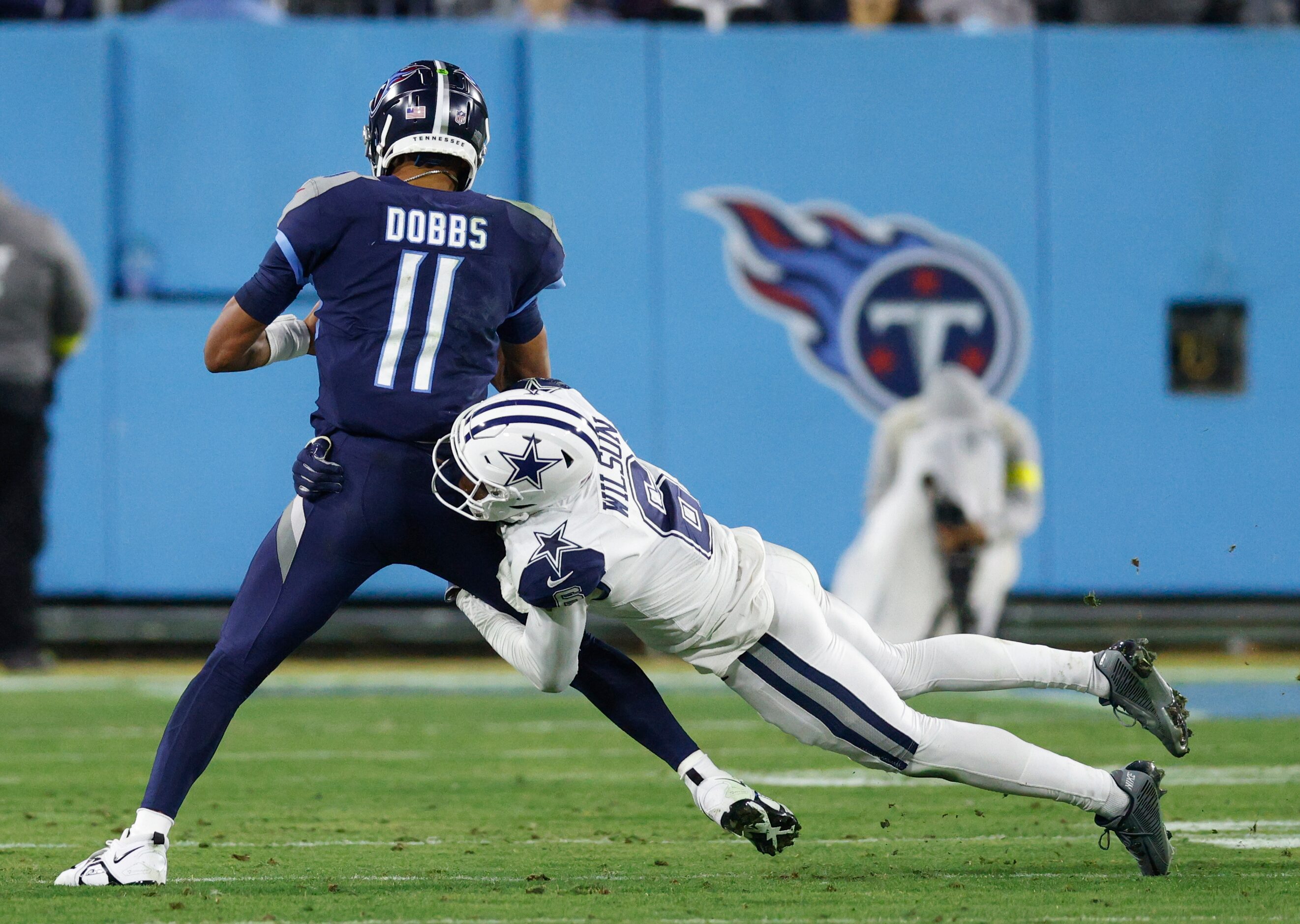 Dallas Cowboys safety Donovan Wilson (6) sacks Tennessee Titans quarterback Joshua Dobbs...