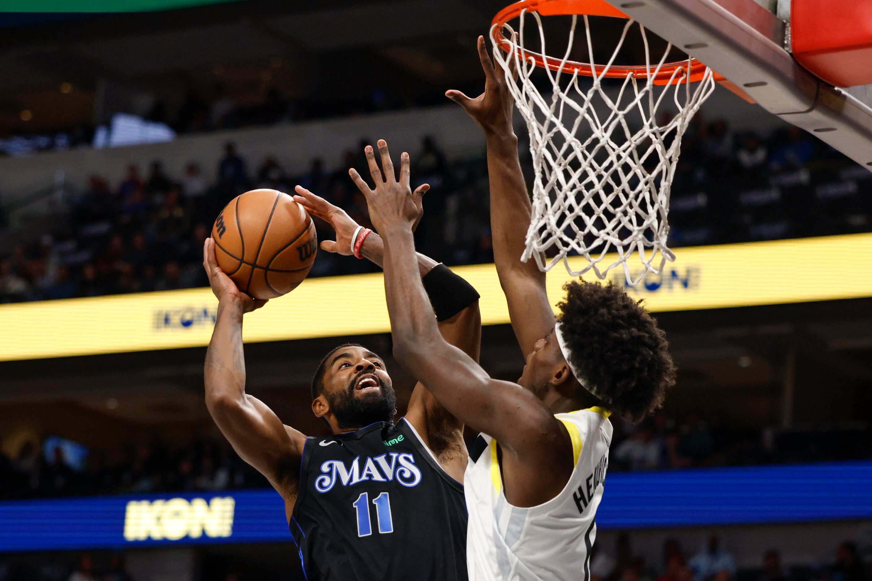 Dallas Mavericks guard Kyrie Irving (11) attempts a layup against Utah Jazz forward Taylor...