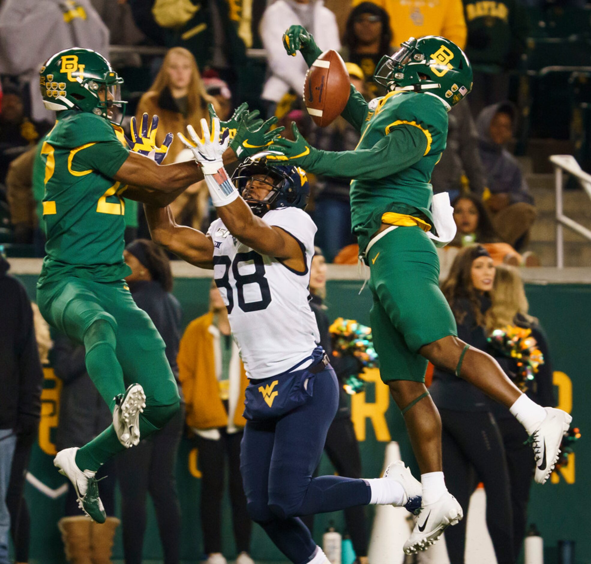 Baylor cornerback Grayland Arnold (1) breaks up a pass intended for West Virginia wide...