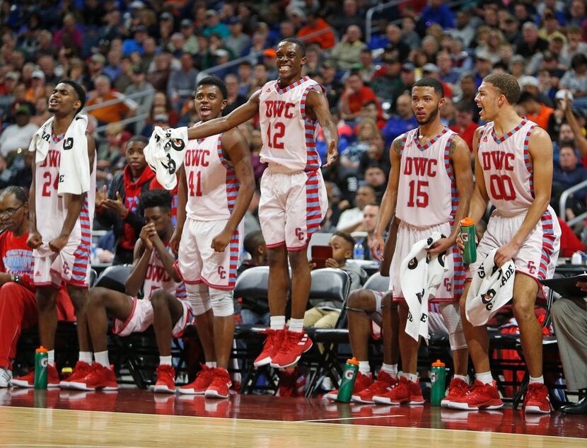 Dallas Carter starters cheer on the reserves in closing minutes of Friday's Class 4A boys...