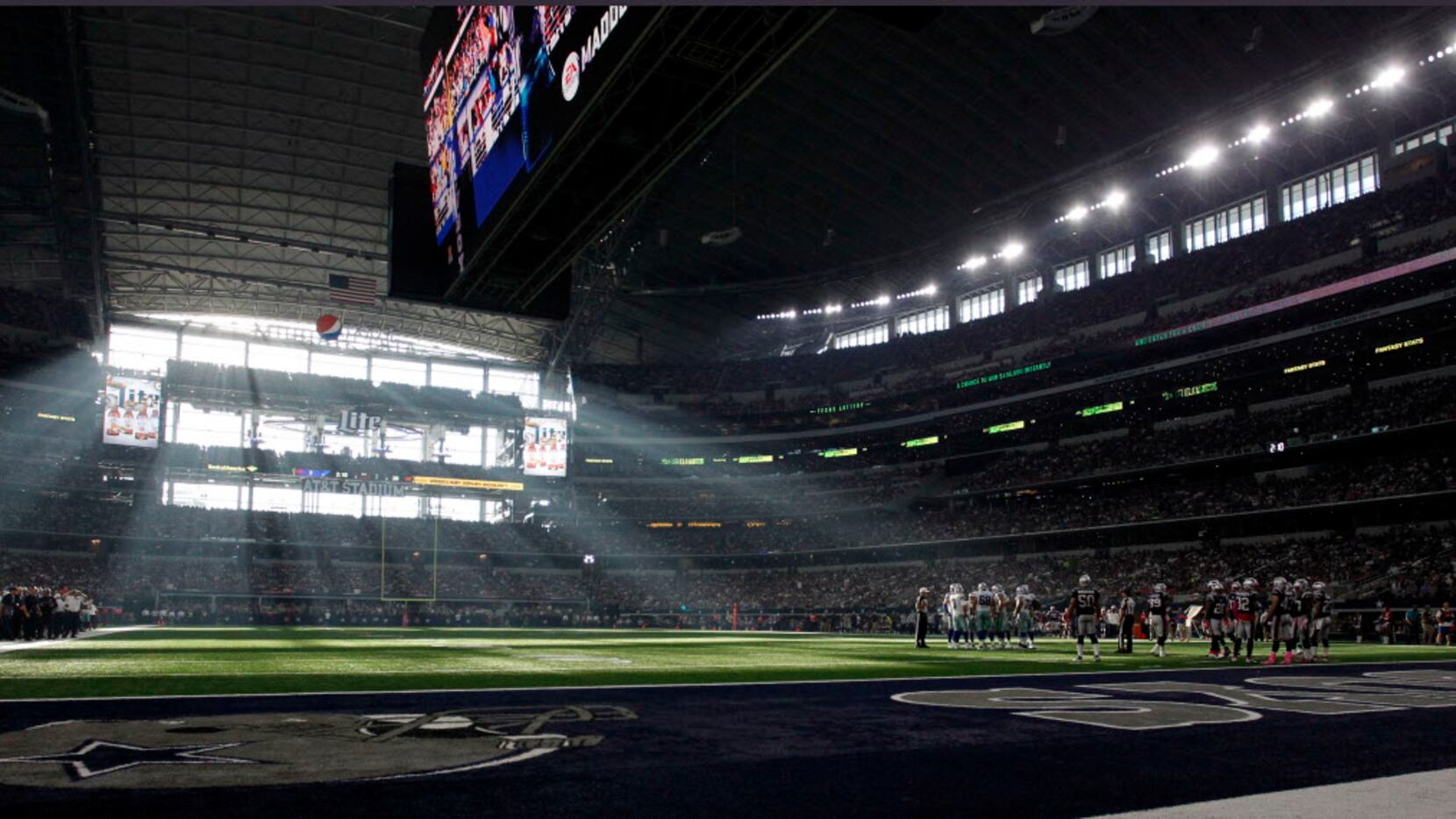 Dramatic window light floods the field during the second half of New England Patriots 30-6...
