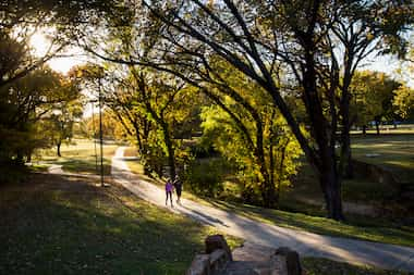 Walkers stroll along the paved trails and historic stonework established during the Works...