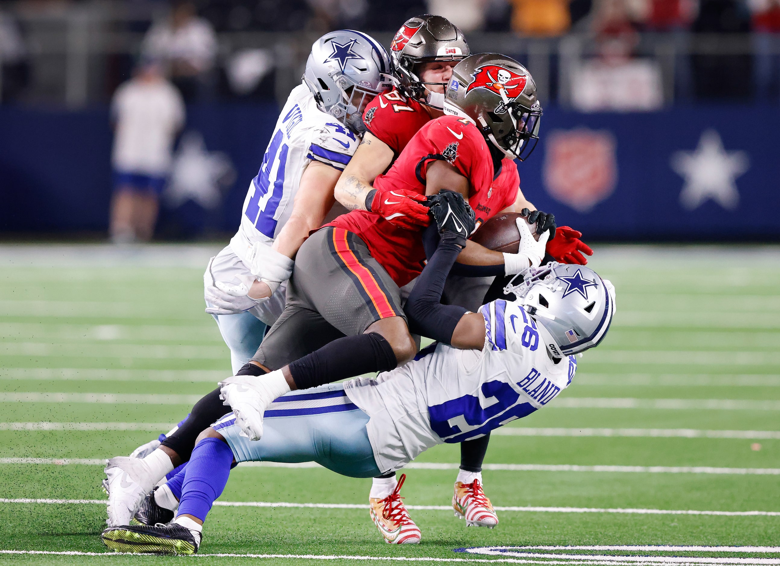 Dallas Cowboys cornerback DaRon Bland (26) rips the ball from Tampa Bay Buccaneers running...