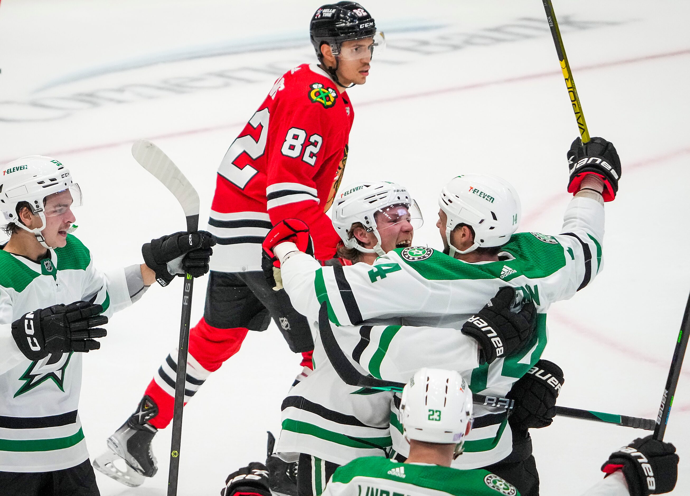 Dallas Stars center Ty Dellandrea (facing) celebrates with left wing Jamie Benn (14) after...