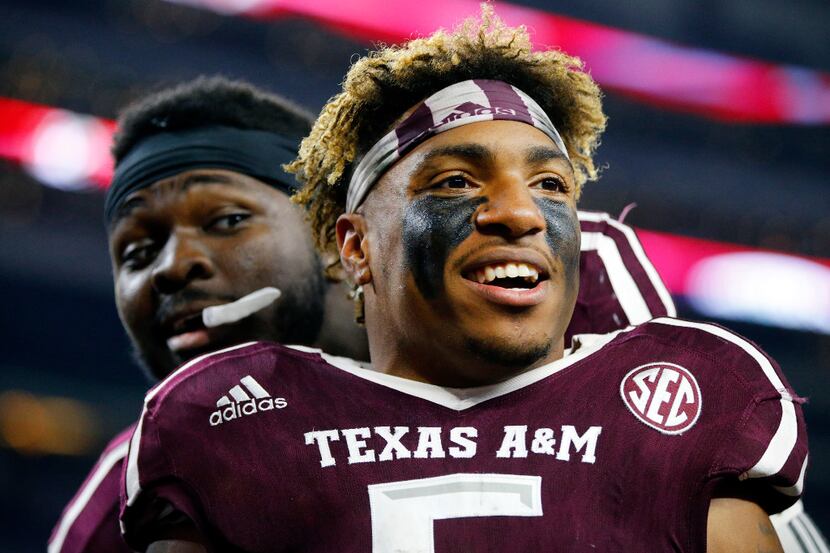 Texas A&M Aggies running back Trayveon Williams (5) is all smiles after his two touchdown...