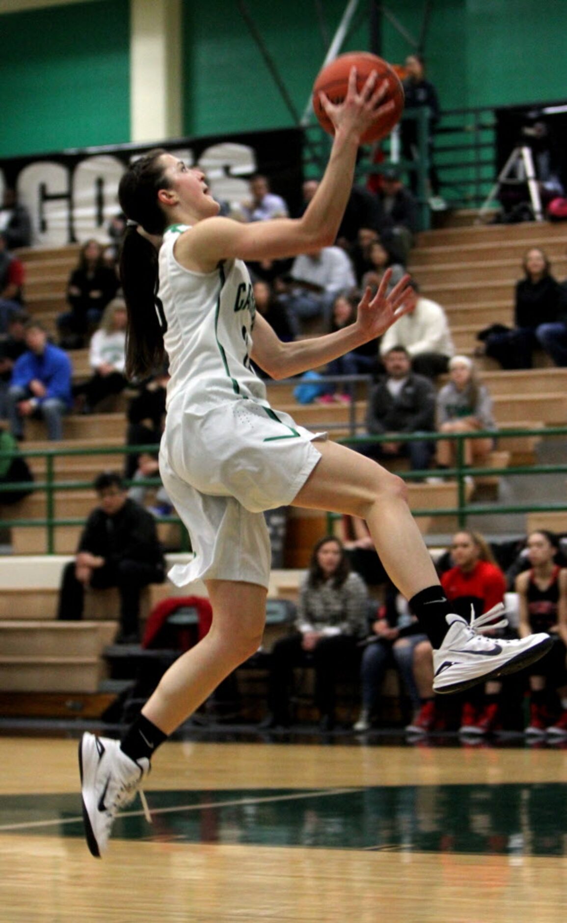 Southlake Carroll forward Priscilla Smeenge (23) flies through the air uncontested  to the...