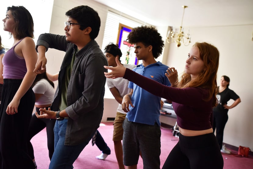 Ollin Barraza Fernandez, 18, left, Landon Robinson, 15, and Angie Hogue, 17, right, rehearse...