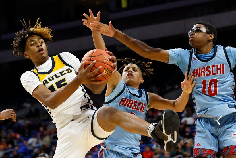 Oak Cliff Faith Family Academy forward JT Toppin (15) collects a rebound over Wichita Falls...