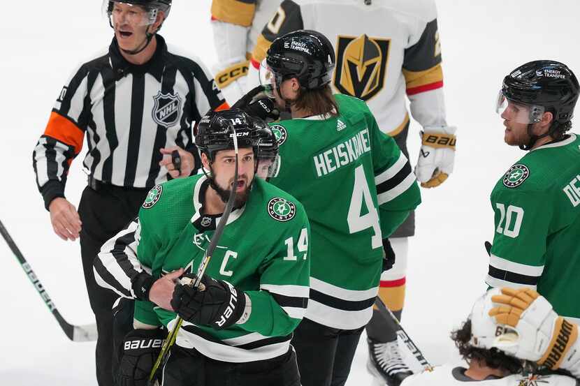 Dallas Stars left wing Jamie Benn (14) is sent off the ice after collecting a five minute...