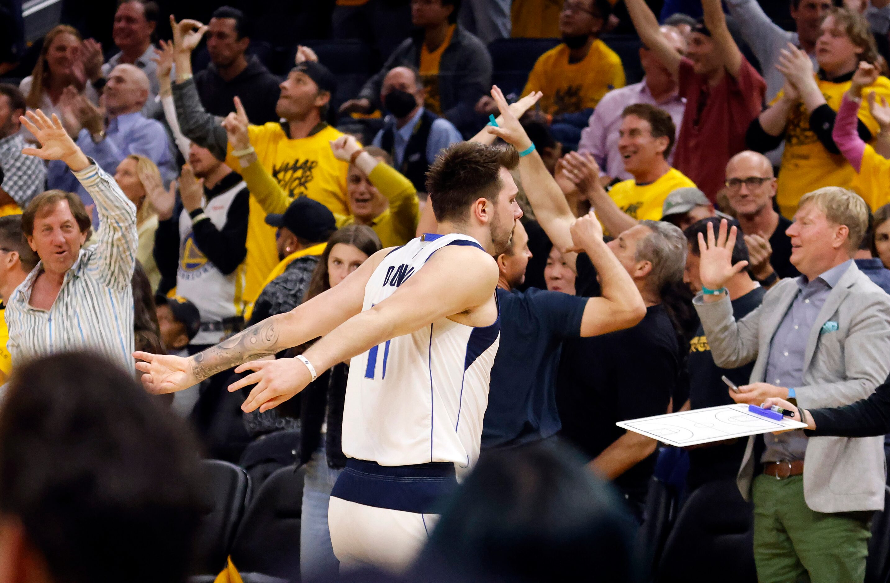 Dallas Mavericks guard Luka Doncic (77) swings his arms in disgust during a third quarter...