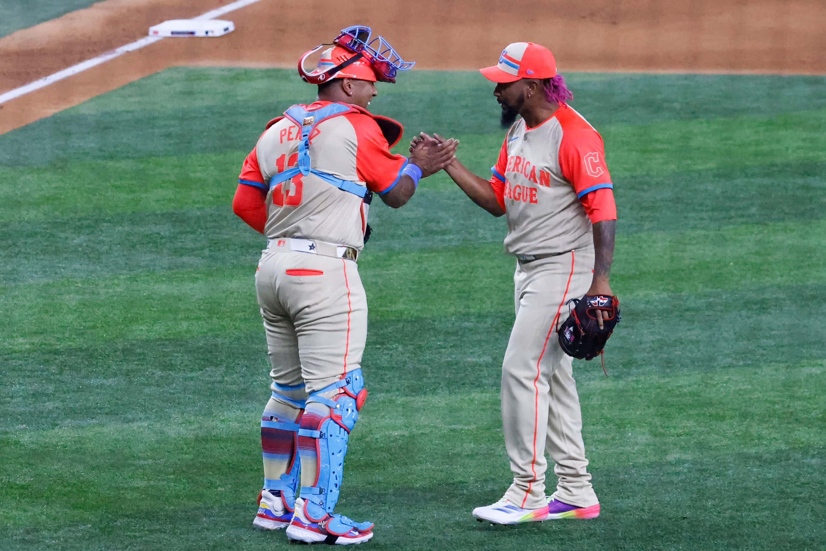American League's Emmanuel Clase (right) of the Cleveland Guardians, and Salvador Perez, of...