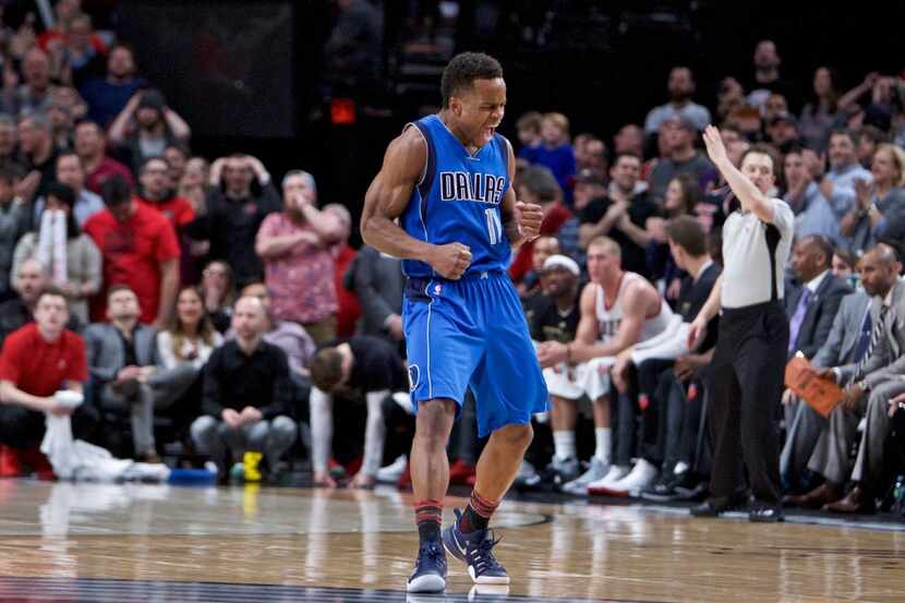 Dallas Mavericks guard Yogi Ferrell reacts after making a 3-point basket against the...