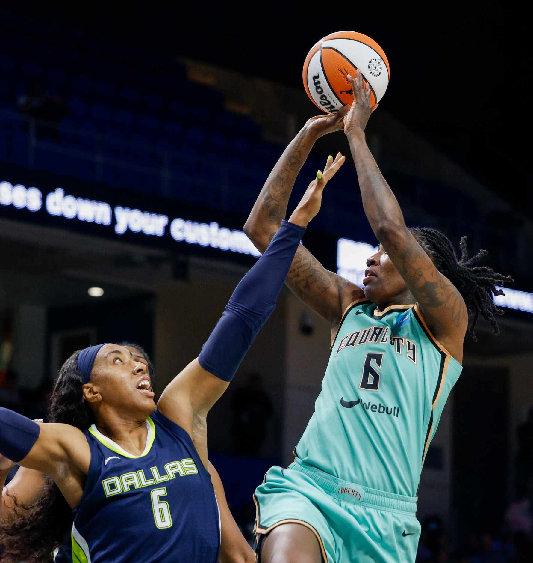 New York Liberty forward Natasha Howard (6) shoots the ball over the outstretched arm of...