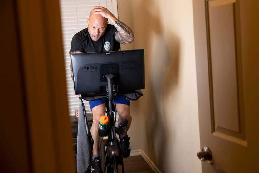 Dallas police Chief Eddie García finishes his daily workout by doing cardio on his Peleton...