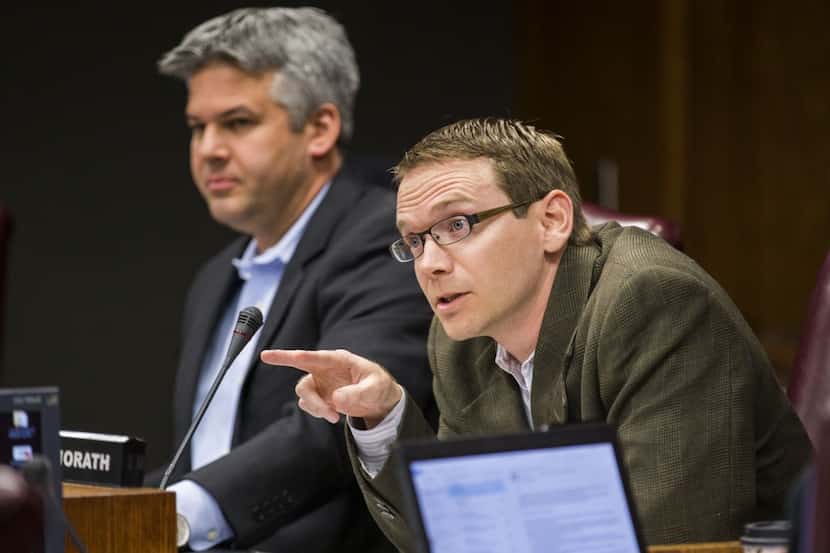  DISD Trustee District 2 Mike Morath, right, asks a question to attorneys before the DISD...