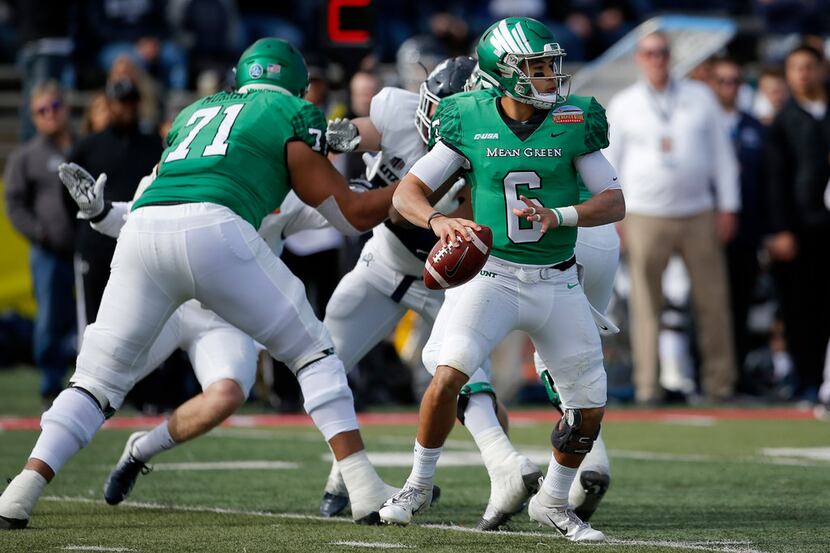 North Texas quarterback Mason Fine (6) looks to throw a pass during the first half of the...