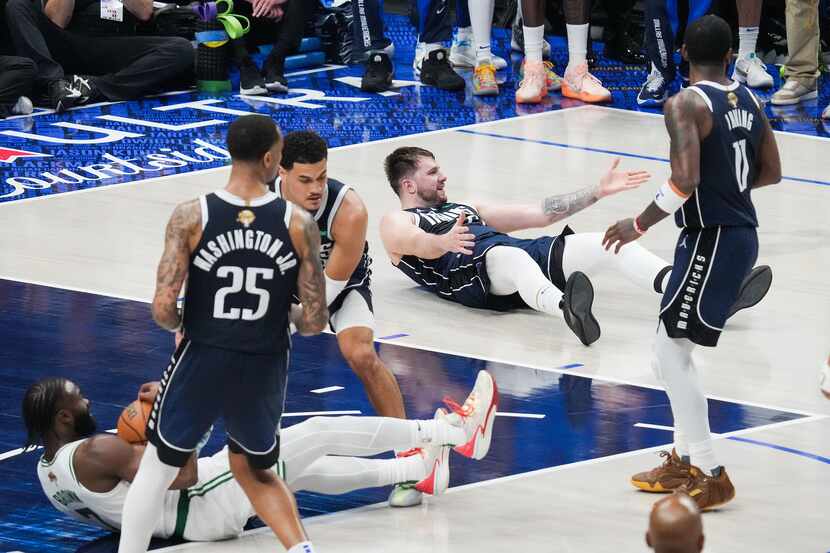 Dallas Mavericks guard Luka Doncic (77) reacts after being called for his sixth foul while...