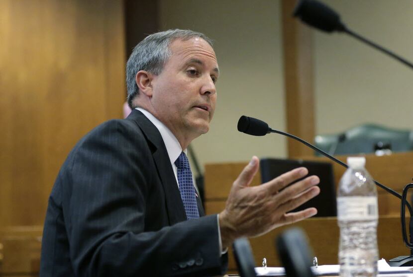 In this July 29, 2015 file photo, Texas Attorney General Ken Paxton speaks during a hearing...