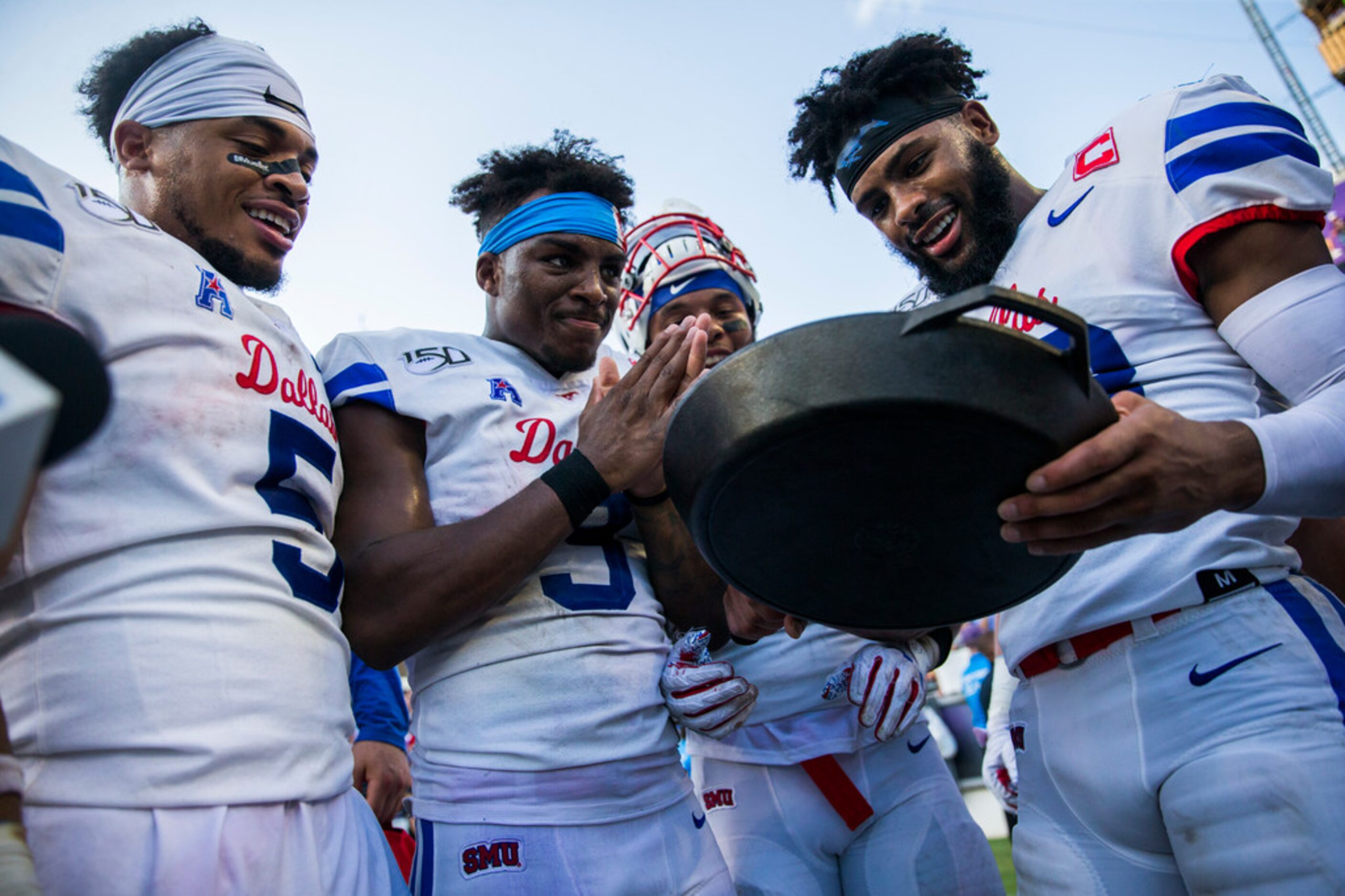 Southern Methodist Mustangs celebrate a 41-38 win over TCU Horned Frogs by hoisting the...