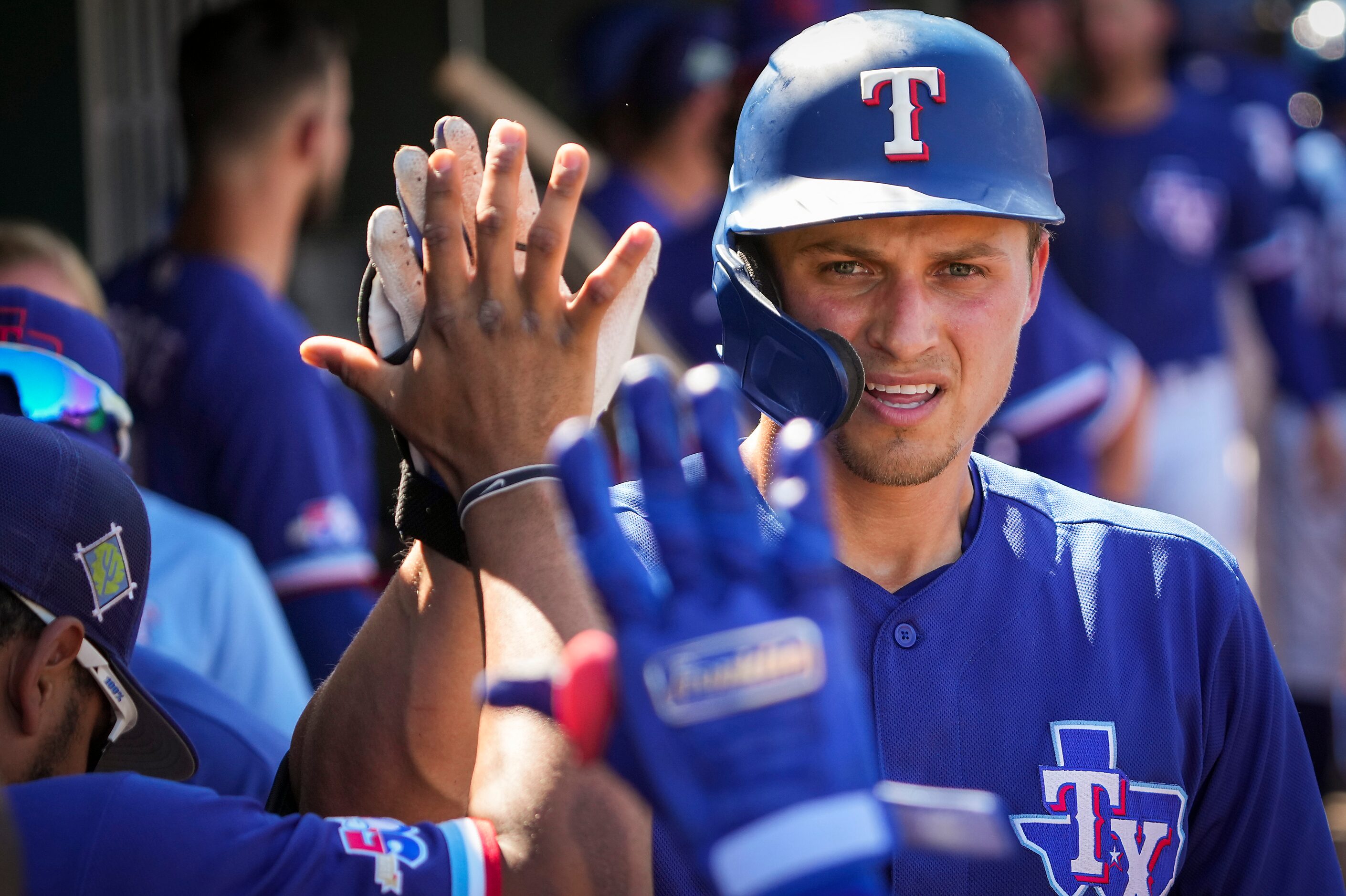 Texas Rangers shortstop Corey Seager celebrates with teammates after hitting a home run...