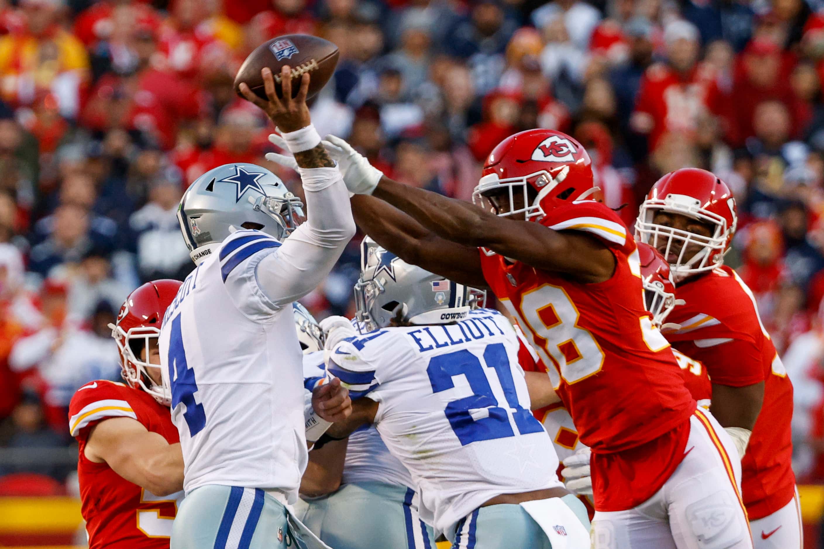 Dallas Cowboys quarterback Dak Prescott (4) is hit as he throws by Kansas City Chiefs...