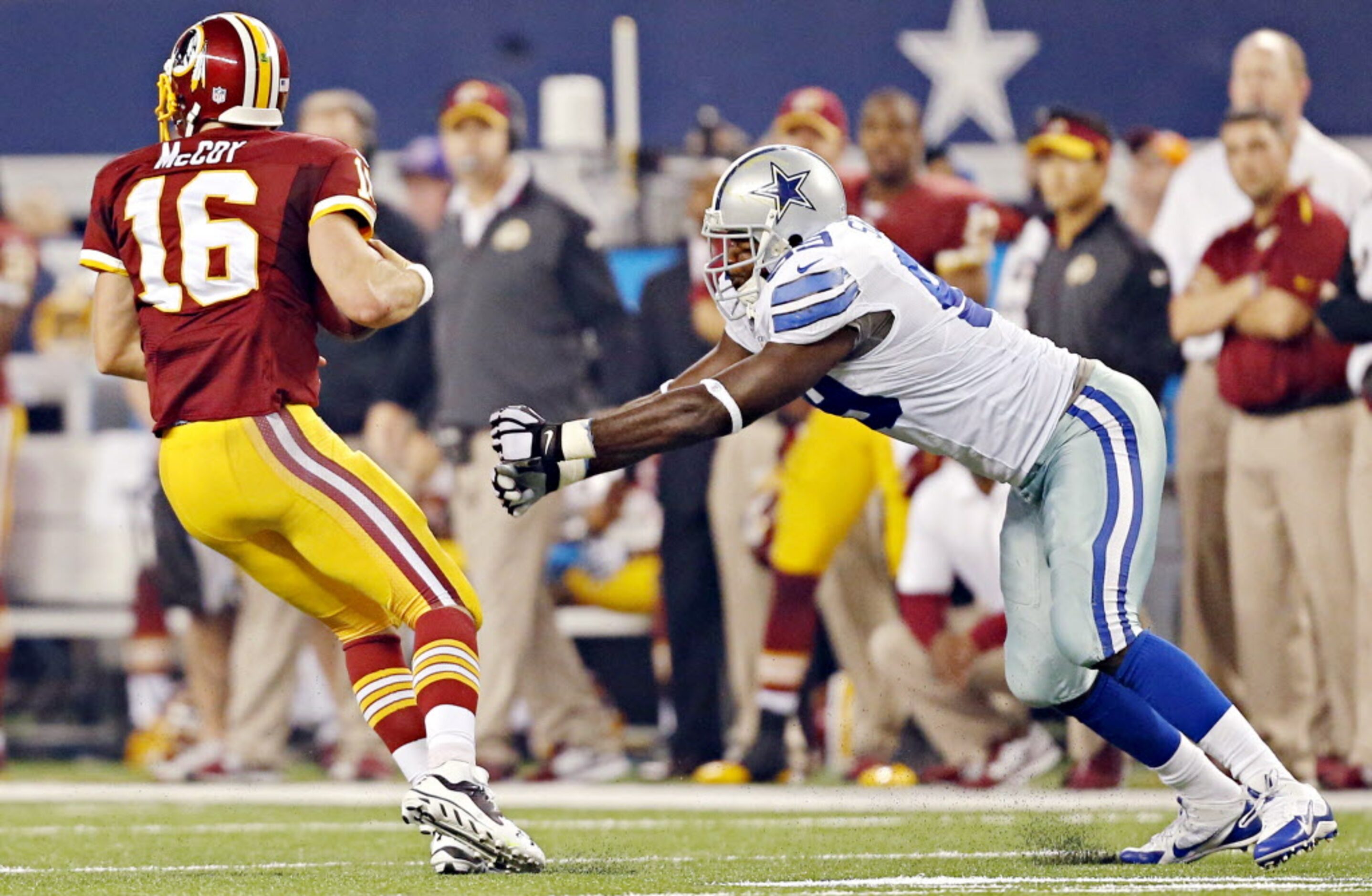 Washington Redskins quarterback Colt McCoy (16) whips away from a sack attempt by Dallas...