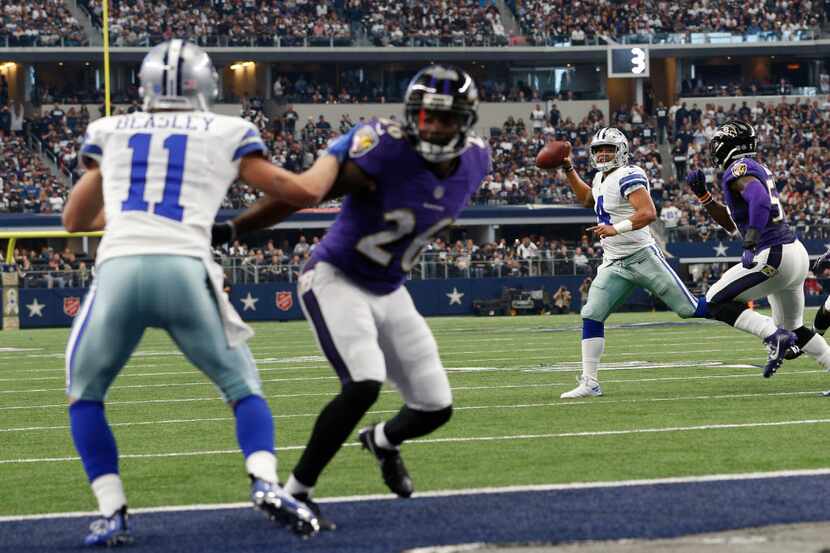 Dallas Cowboys quarterback Dak Prescott (4) passes a touchdown pass to wide receiver Cole...