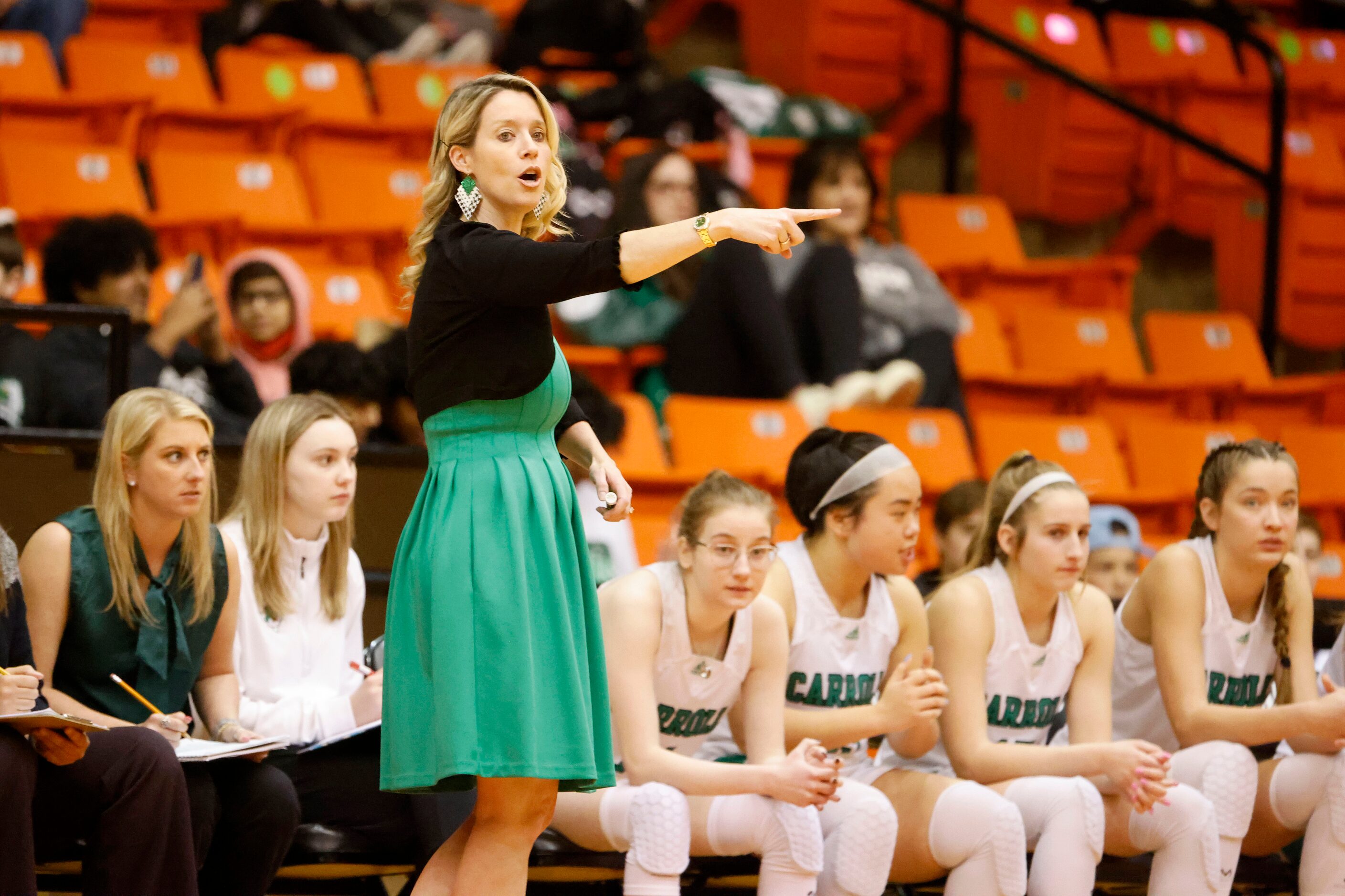 Southlake basketball coach Robyn McCoart directs her team as they played South Grand Prairie...