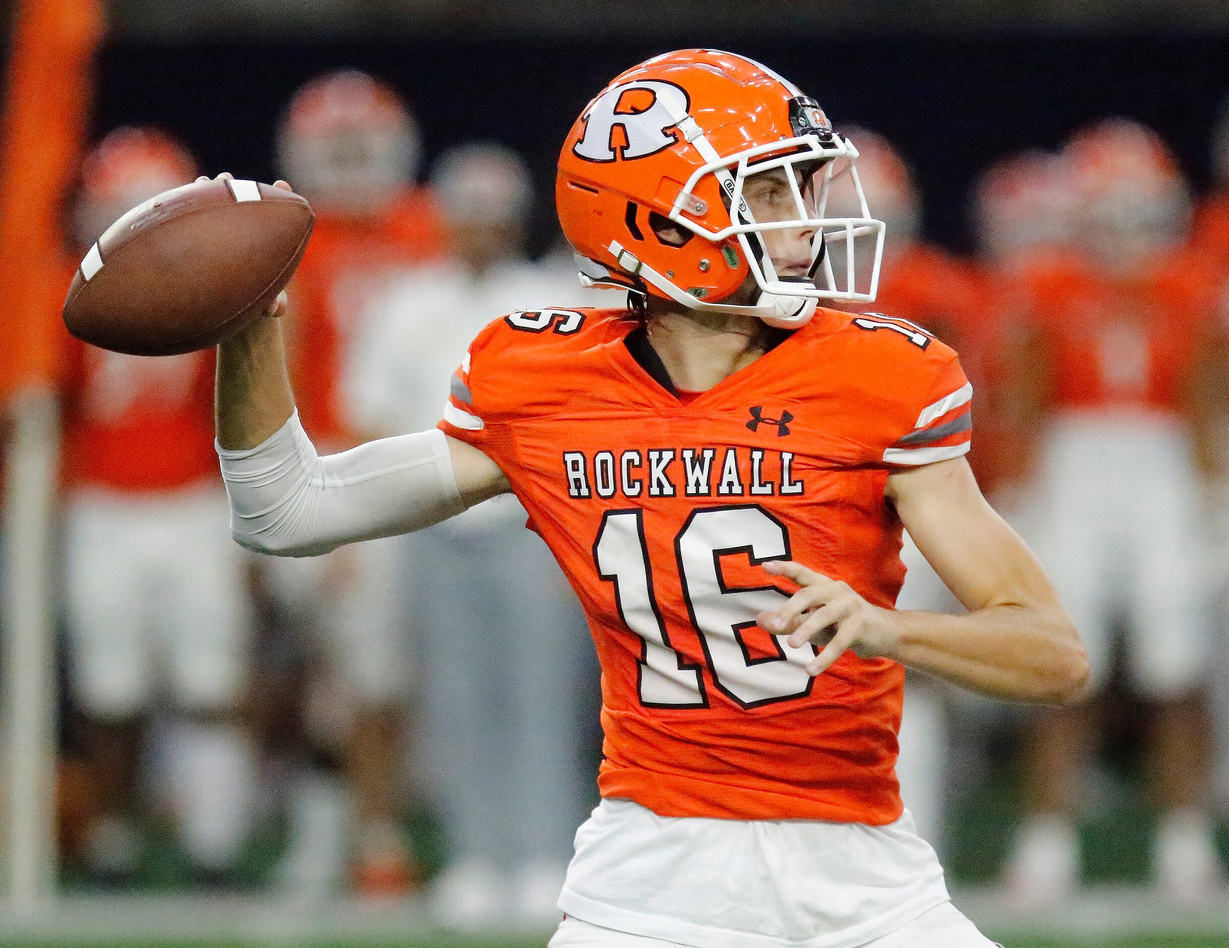 Rockwall High School quarterback Mason Marshall (16) throws a pass during the first half as...