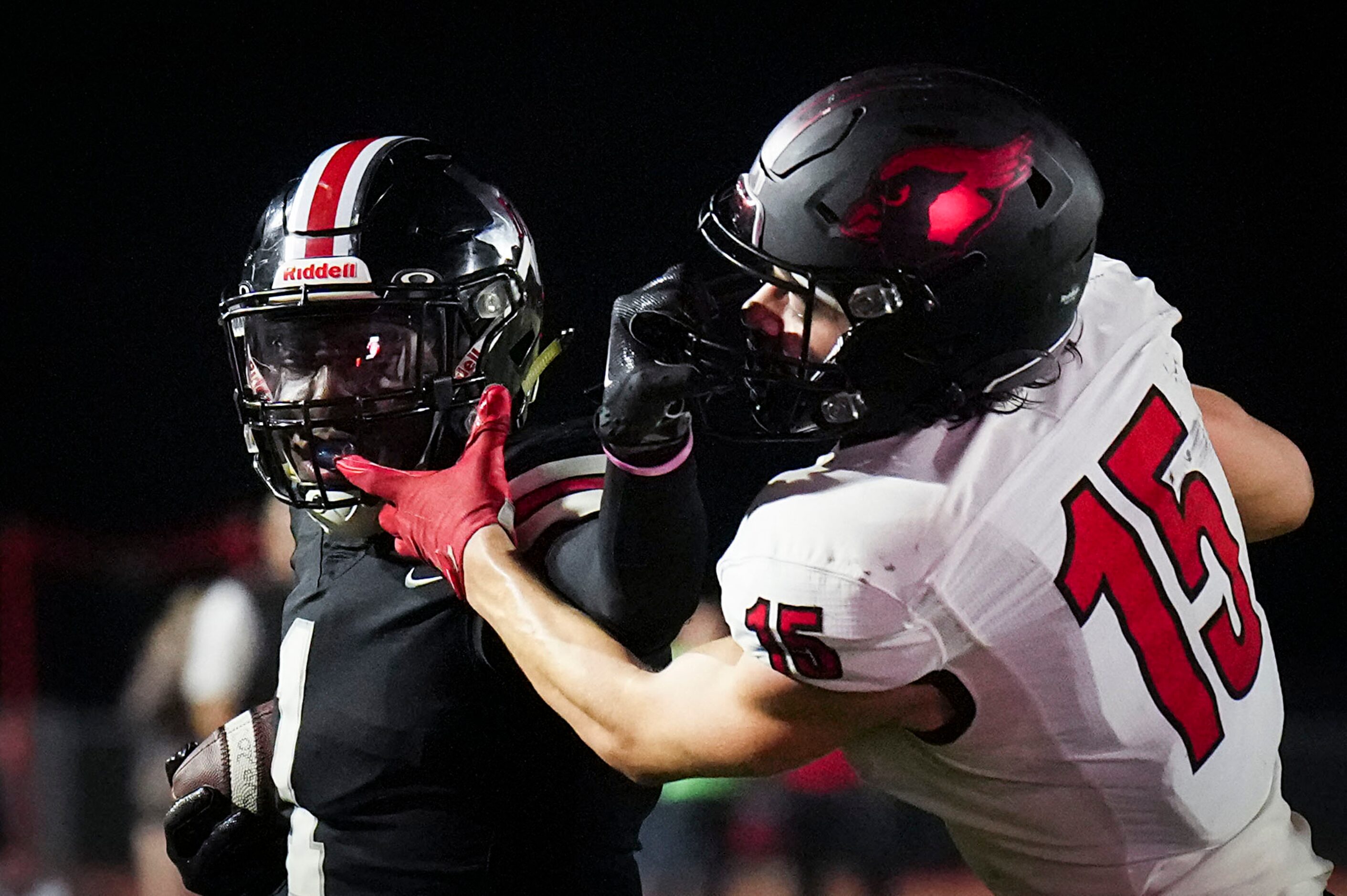 Lovejoy wide receiver Kyle Parker (1) is brouth down by Melissa defensive back Jake Potucek...