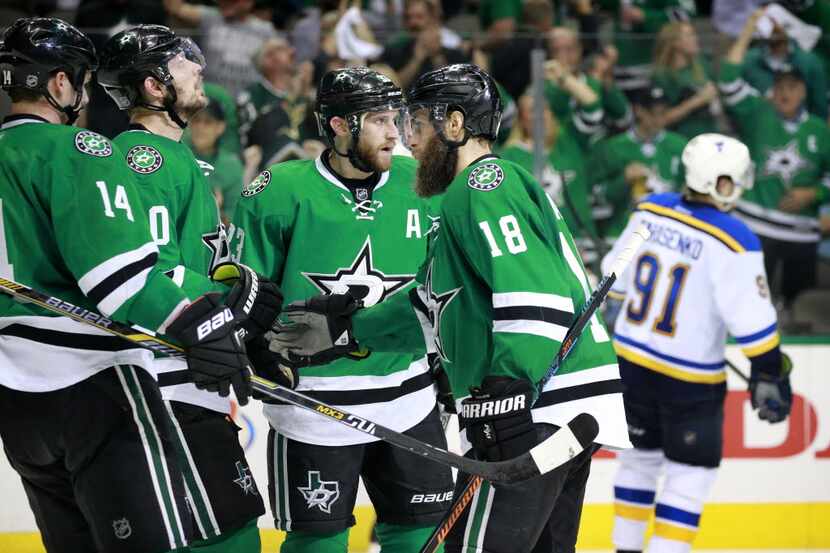 Dallas Stars right wing Patrick Eaves (18) is congratulated on his third period goal against...
