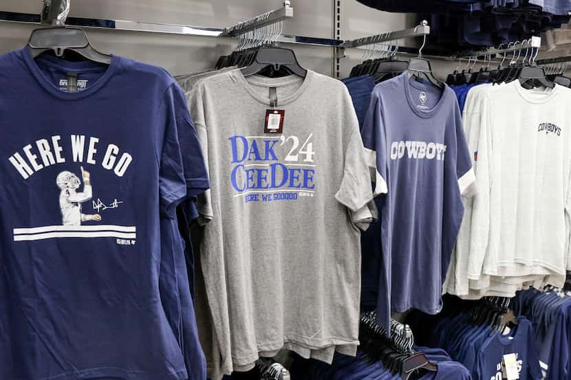 Dallas Cowboys quarterback Dak Prescott's pre-snap "Here we go" chant adorns T-shirts on...
