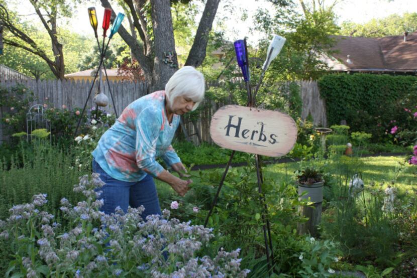 Arlene Hamilton demonstrates some of the selections in the edible island of her Waxahachie...