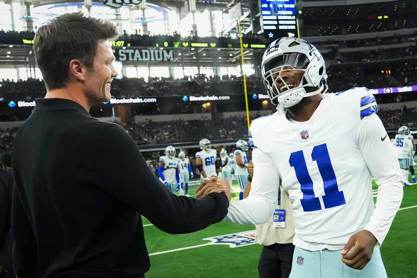 Dallas Cowboys linebacker Micah Parsons shakes hands with Tom Brady before an NFL preseason...