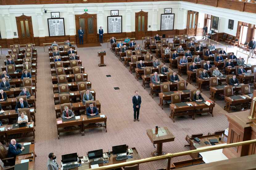 Speaker Dade Phelan posed for a picture in the middle of the chamber as Republican Texas...