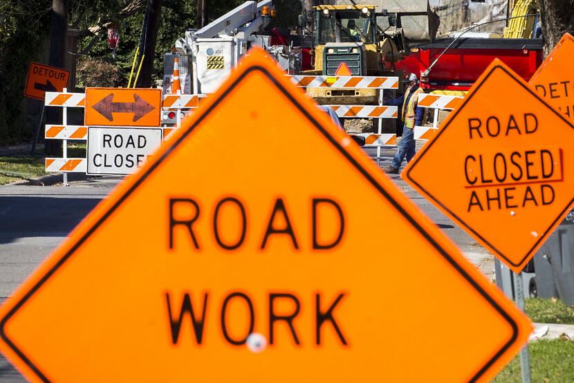 Signs point the way to a detour as crews work on street construction in this file photo.