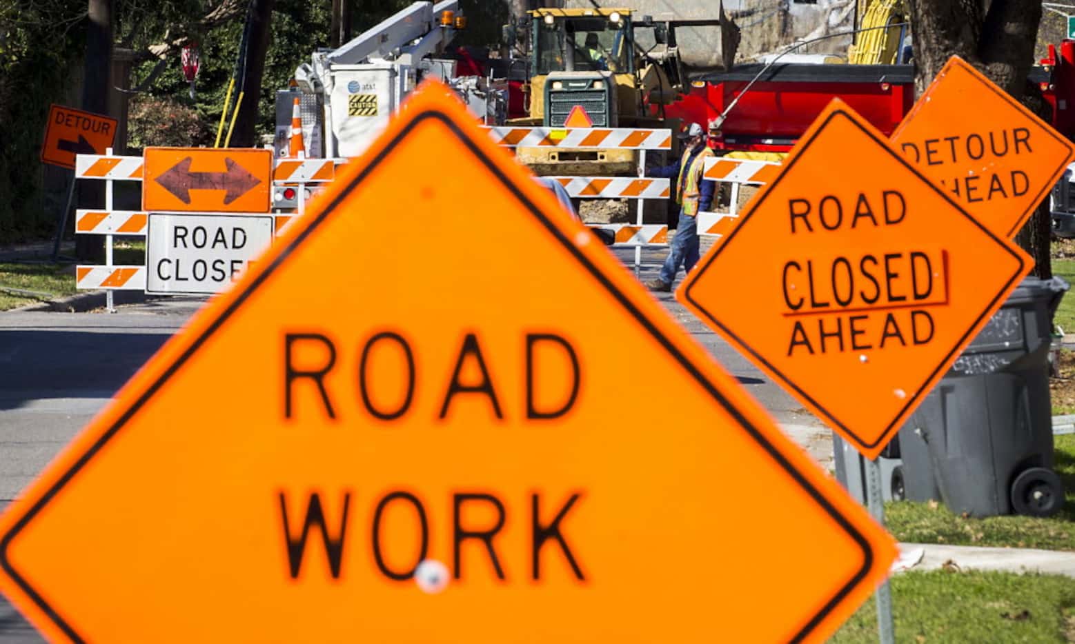 Signs point the way to a detour as crews work on street construction.