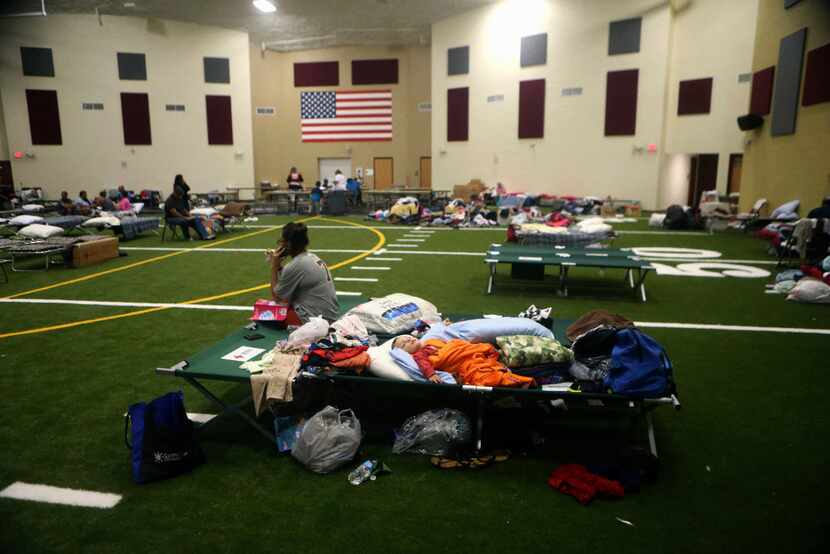 Families take shelter at a FEMA dome after Hurricane Harvey displaced them Aug. 30, 2017, at...