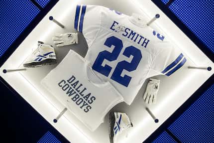 At the new Post Malone and Dallas Cowboys Raising Cane's restaurant, football memorabilia is...