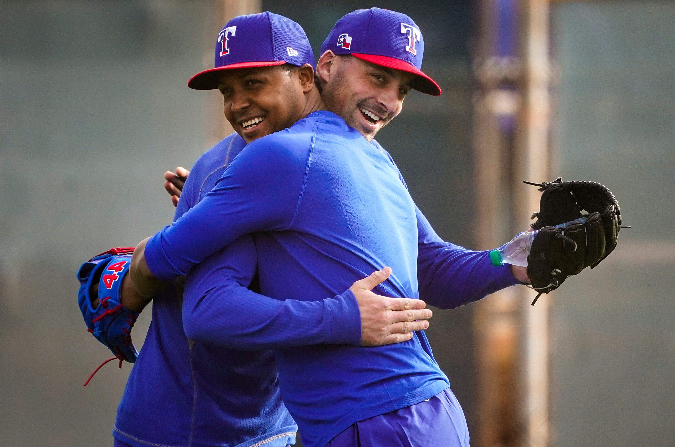 Texas Rangers pitcher Jose Leclerc (left) hugs pitcher Taylor Guerrieri on the day pitchers...