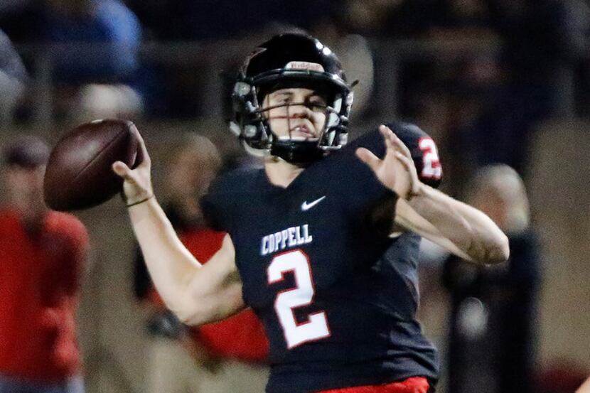 Coppell High School quarterback Brady McBride (2) throws a touchdown pass during the first...