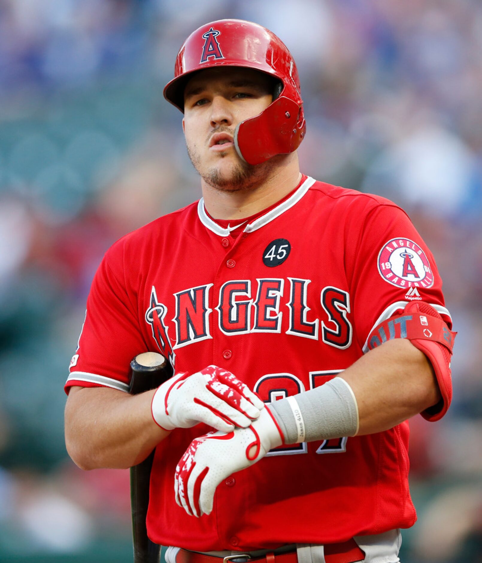 Los Angeles Angels center fielder Mike Trout (27) tightes his gloves while at bat during the...