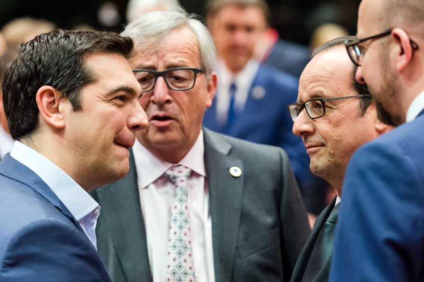 Greek Prime Minister Alexis Tsipras, left, speaks with, from left, European Commission...