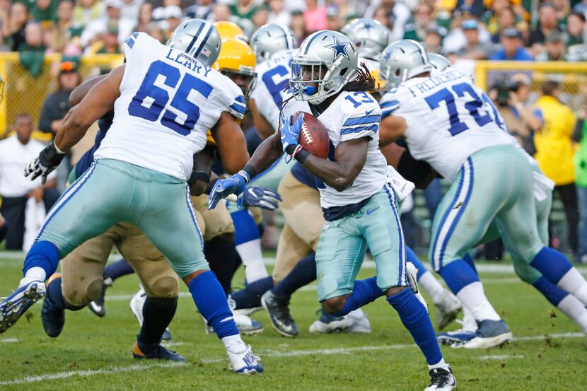 Dallas Cowboys wide receiver Lucky Whitehead (13) rushes for yardage during the Dallas...